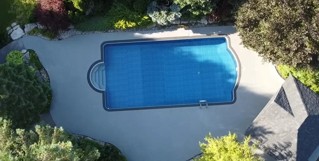 After: resurfaced pool deck with new border, aerial view