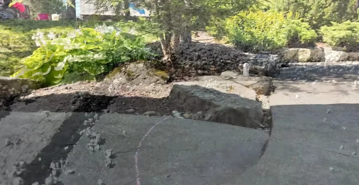 Marking a crack in a concrete driveway surface for repair
